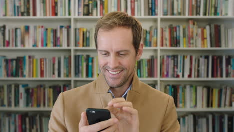 portrait-of-attractive-caucasian-businessman-texting-browsing-online-research-using-smartphone-technology-in-library-bookshelf-background