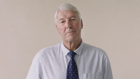 portrait-of-serious-elderly-businessman-standing-expressionless