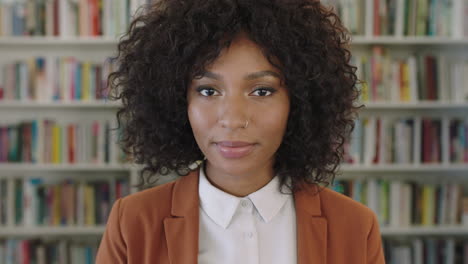 close-up-portrait-of-stylish-african-american-business-woman-intern-looking-serious-pensive-at-camera-in-library-bookshelf-background