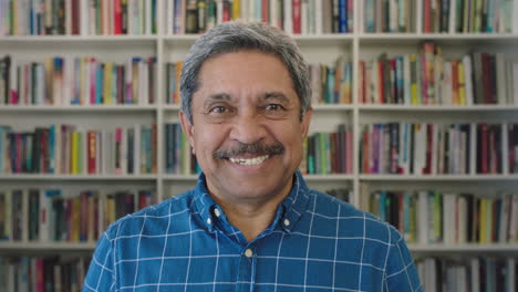 close-up-portrait-of-happy-mature-mixed-race-man-smiling-cheerful-in-library-bookcase-background-successful-senior-male-enjoying-relaxed-lifestyle