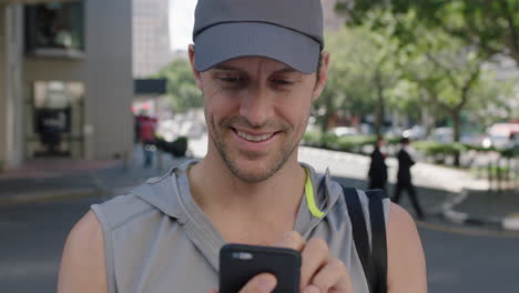 portrait-of-attractive-fit-young-man-texting-browsing-using-app-smartphone-smiling-happy-enjoying-urban-lifestyle
