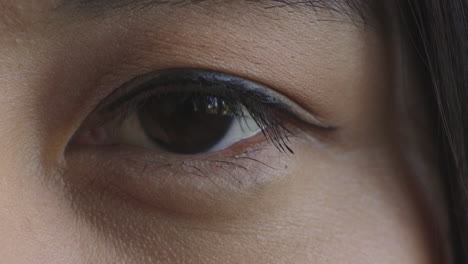 close-up-of-asian-woman-eye-blinking-looking-at-camera