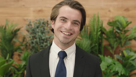 attractive-young-business-man-portrait-of-sales-person-wearing-suit-smiling-happy-enjoying-successful-lifestyle