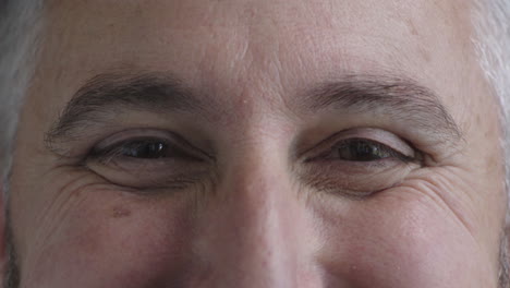 close-up-mature-man-opening-eyes-looking-at-camera-smiling-happy-healthy-eyesight