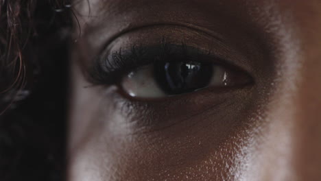 close-up-of-black-woman-eye-blinking-looking-at-camera