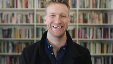 portrait-of-young-happy-businessman-entrepreneur-laughing-cheerful-looking-at-camera-confident-successful-male-in-study-library
