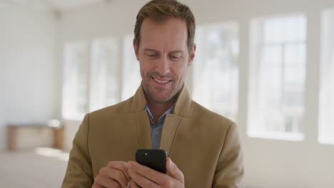 portrait-of-happy-young-man-using-smartphone-smiling-enjoying-mobile-phone-communication-texting-browsing-online-banking-expressing-satisfaction-wearing-jacket