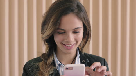 cute-hispanic-woman-portrait-of-beautiful-young-woman-enjoying-texting-browsing-using-smartphone-technology