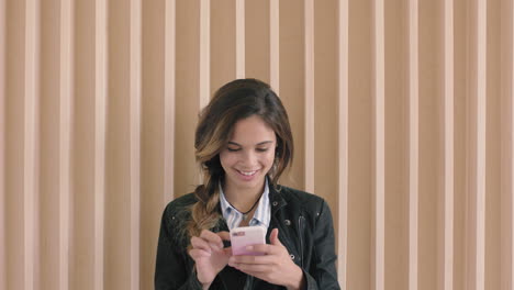 cute-hispanic-woman-portrait-of-beautiful-young-woman-smiling-enjoying-texting-browsing-using-smartphone-technology