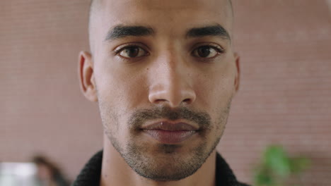 close-up-portrait-of-handsome-young-mixed-race-man-looking-serious-pensive-at-camera