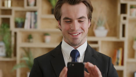portrait-of-successful-young-businessman-using-smartphone-texting-enjoying-browsing-messages-online-on-mobile-phone-internet-connection-technology-slow-motion