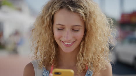 portrait-of-beautiful-blonde-woman-using-smartphone-enjoying-texting-browsing-on-summer-vacation-sharing-experience-online-attractive-female-tourist-beachfront