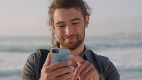 portrait-of-young-man-using-smartphone-texting-browsing-online-sharing-vacation-experience-on-social-media-enjoying-mobile-communication-in-sunny-beach-background