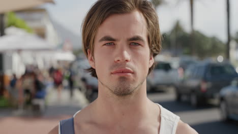 portrait-of-attractive-caucasian-man-looking-serious-handsome-male-tourist-in-warm-sunny-urban-beachfront-background