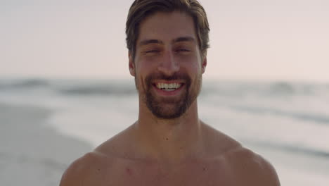 close-up-portrait-of-muscular-young-man-smiling-happy-enjoying-healthy-lifestyle-on-beautiful-seaside-beach-real-people-series