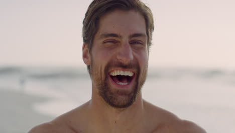 close-up-portrait-of-muscular-young-man-laughing-cheerful-enjoying-healthy-lifestyle-on-beautiful-seaside-beach-real-people-series