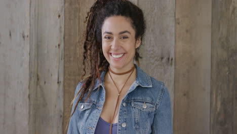 portrait-of-beautiful-young-mixed-race-woman-smiling-happy-enjoying-successful-lifestyle-wearing-dreadlocks-hairstyle-independent-female-denim-fashion-slow-motion