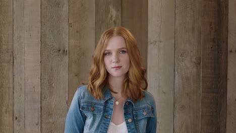 young-stylish-red-head-portrait-of-beautiful-woman-looking-at-camera-pensive-calm-wearing-denim-jacket