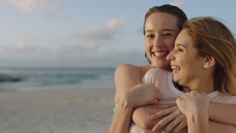 girlfriends-embracing-on-beach-at-sunset-beautiful-couple-together-on-beach-happy