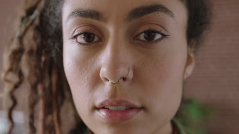 close-up-portrait-of-attractive-mixed-race-woman-face-looking-serious-pensive-at-camera-independent-woman-focused-intense