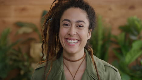 portrait-of-beautiful-young-mixed-race-woman-smiling-happy-enjoying-successful-lifestyle-wearing-dreadlocks-hairstyle-independent-female-slow-motion