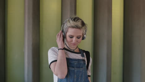 portrait-of-young-woman-wearing-headphones-listening-to-music-alternative-grunge