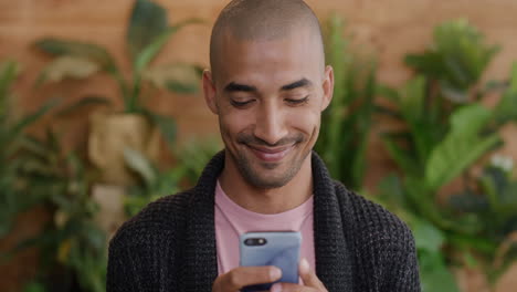 close-up-portrait-of-young-hispanic-man-using-smartphone-reading-text-messages-online-looking-pensive-mobile-communication-slow-motion