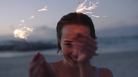attractive-young-woman-holding-sparklers-dancing-on-beach-cheerful-happy