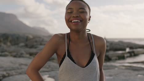portrait-of-proud-african-american-woman-at-beach-laughing-happy-confident
