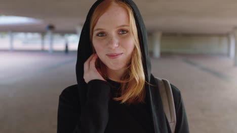 portrait-of-young-redhead-woman-smiling-shy-wearing-hoodie