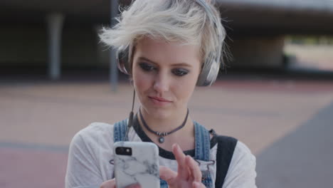 portrait-beautiful-young-woman-teenager-using-smartphone-enjoying-texting-messaging-on-mobile-phone-communication-app-wearing-headphones