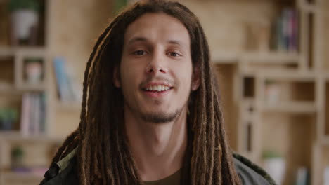 portrait-confident-young-mixed-race-man-smiling-enjoying-independent-lifestyle-relaxed-male-student-with-dreadlocks-hairstyle-slow-motion