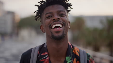 portrait-happy-african-american-man-laughing-cheerful-attractive-black-tourist-enjoying-summer-vacation-travel-looking-relaxed-funky-hairstyle-slow-motion