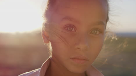close-up-portrait-young-little-mixed-race-girl-looking-serious-contemplative-kid-on-sunny-park-sunset-slow-motion