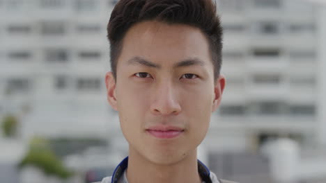 Primer-Plano-Retrato-Confiado-Joven-Asiático-Estudiante-Mirando-Serio-Guapo-étnico-Adolescente-Masculino-Movimiento-Lento