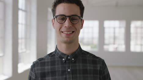 close-up-portrait-of-attractive-young-hipster-man-wearing-glasses-smiling-confident-enjoying-successful-lifestyle-move-independent-male-in-new-apartment