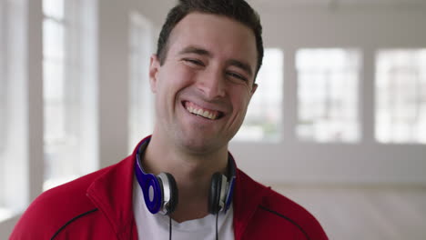 close-up-portrait-of-young-caucasian-man-laughing-cheerful-enjoying-new-apartment-lifestyle-change