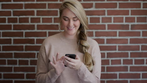 portrait-beauitful-young-blonde-woman-using-smartphone-browsing-sending-text-messages-enjoying-mobile-communication-slow-motion