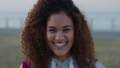 portrait-beautiful-mixed-race-woman-laughing-enjoying-successful-vacation-lifestyle-relaxing-young-female-looking-happy-on-seaside-background-frizzy-hairstyle