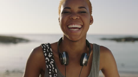 portrait-of--young-funky-african-american-woman-laughing-playful-on-beautiful-sunny-beach