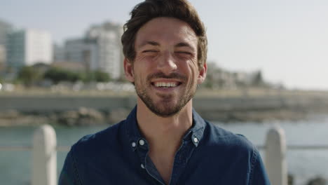 portrait-of-attractive-young-man-laughing-cheerful-enjoying-relaxed-sunny-beachfront