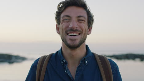 portrait-of-handsome-charming-caucasian-man-laughing-cheerful-on-seaside-beach