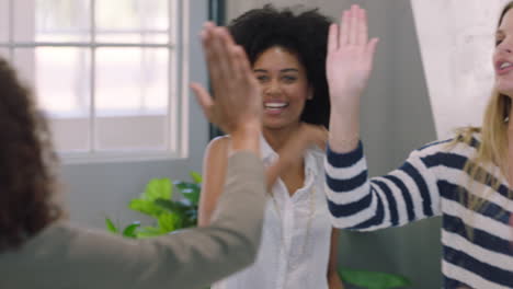 happy-business-people-meeting-in-boardroom-celebrating-successful-project-diverse-team-of-women-high-five-enjoying-success-clapping-in-office-workplace-presentation