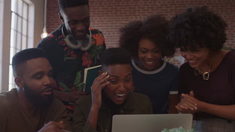 group-of-business-people-celebrating-corporate-success-black-colleagues-laughing-clapping-cheerful-enjoying-successful-victory-watching-laptop-in-modern-office-workplace