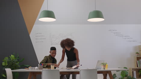 african-american-business-people-meeting-team-leader-woman-training-colleague-sharing-creative-ideas-working-on-finance-project-together-in-modern-office-boardroom