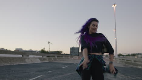 dancing-woman-beautiful-street-dancer-with-colorful-hair-performing-contemporary-hip-hop-moves-enjoying-modern-dance-expression-in-city-at-sunset