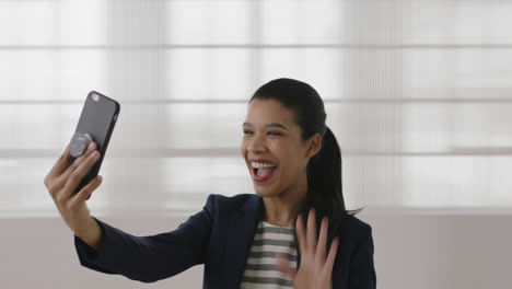 portrait-of-young-business-woman-executive-using-smartphone-video-chat-technology-smiling-happy-greeting-waving-hand-enjoying-mobile-communication