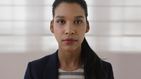 portrait-of-young-mixed-race-business-woman-executive-looking-serious-at-camera-professional-female-entrepreneur-close-up