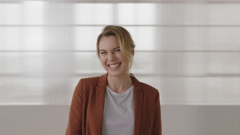 stylish-business-woman-portrait-of-attractive-blonde-executive-laughing-cheerful-looking-at-camera-greeting-waving-hand