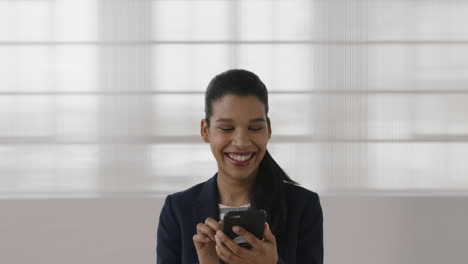 portrait-of-young-hispanic-business-woman-executive-smiling-happy-texting-browsing-using-smartphone-online-networking-enjoying-mobile-communication